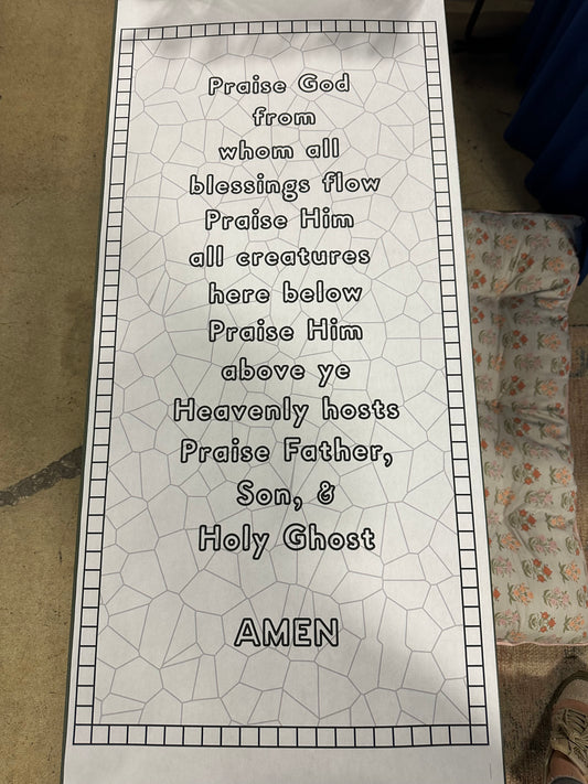 Prayer mat with printed text on a tiled floor